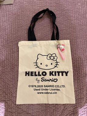 Sanrio Hello Kitty Cream Tote with Black Handles and Pink Charm